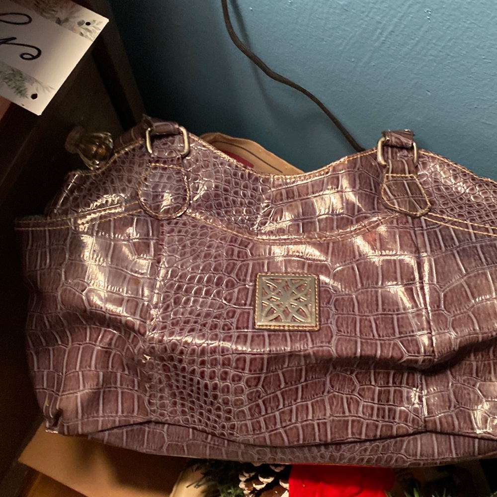 Beautiful blue/gray purse with plenty pockets! Little tear on handle